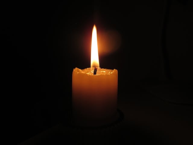 memorial candle flame symbolizing thoughtful planning and remembrance for DeLand FL cremation services.