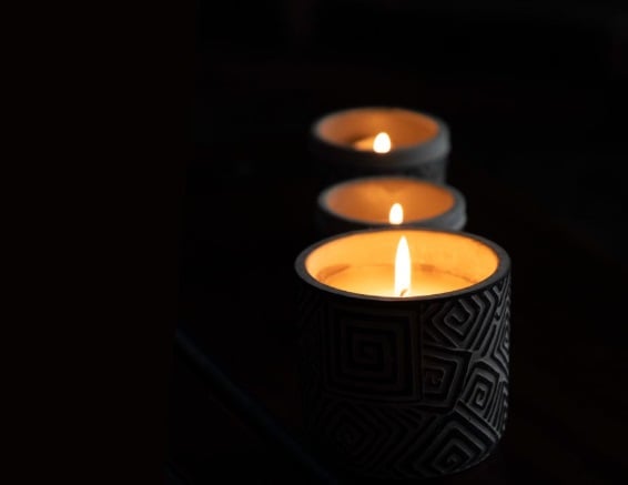 Memorial candles representing Deltona, FL cremations with warm candlelight and peaceful remembrance setting.