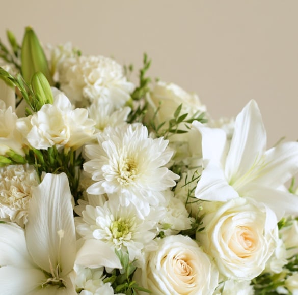 White flower arrangement for cremation memorial services in DeLand, FL.